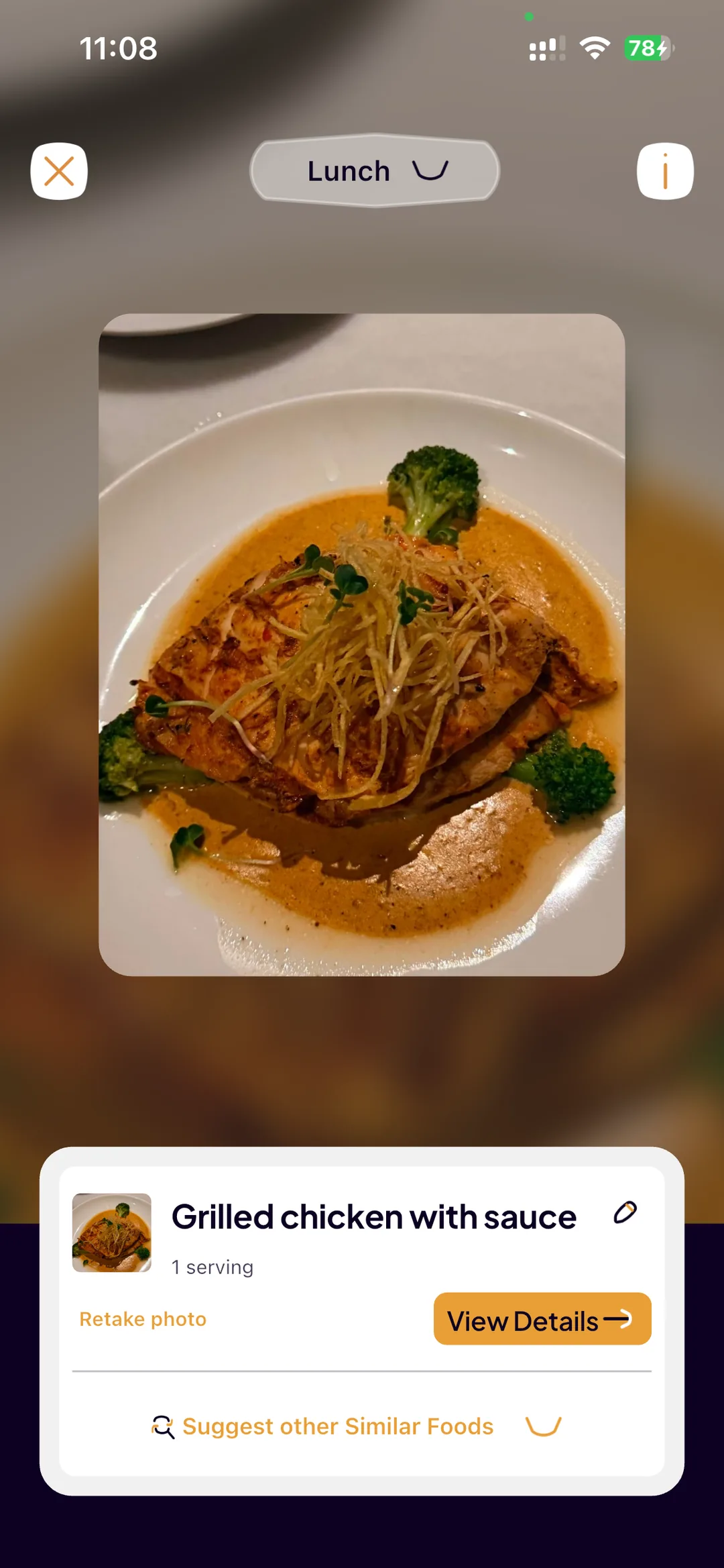 A photo of grilled chicken taken in SlimAI, recognised as “Grilled chicken with sauce” at one serving, with options to view details or retake